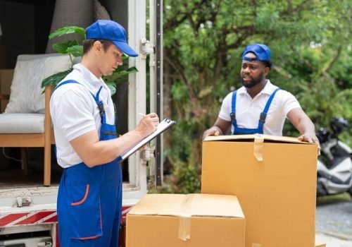 imgi_14_man-mover-blue-uniform-checking-lists-clipboard-while-unloading-cardboard-boxes-from-truck_34755-1587
