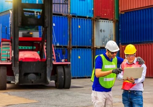 imgi_22_foreman-is-controlling-air-sea-freight-employee-holding-laptop-front-container_1610088-2236